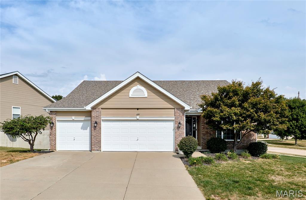 Welcome to 699 Springfield Dr in Wentzville! This 3 bedroom, 3 full bath home, built in 2013, offers a great combination of space, functionality, and location. Situated on a large corner lot, the property offers plenty of outdoor space and great curb appeal. Inside, you'll find a spacious layout with room for everyday living and entertaining. The large primary bedroom provides plenty of room to unwind, while the spacious primary bathroom offers a comfortable retreat. The finished basement is an entertainer's dream, featuring a pool table and custom bar that create the perfect space for game nights, gatherings, or relaxing with friends and family. Located in a fantastic Wentzville location with convenient access to shopping, dining, parks, schools, and major roadways. Don't miss your opportunity to make this well located home your own!