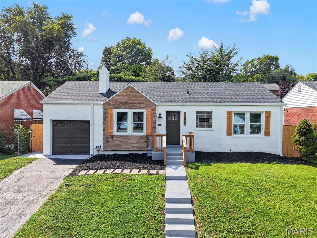 Fully redesigned brick bungalow on a quiet cul-de-sac in University City's Grenville subdivision, with over 1,500 sq ft of finished living space across two levels.

The main floor opens to a sunlit living room with a brick fireplace, recessed lighting, and wide-plank luxury vinyl flooring that runs throughout. Arched doorways lead to the eat-in kitchen: white cabinetry, quartz countertops, subway tile backsplash, stainless appliances, and matte black fixtures. Two bedrooms and a full bath with a tiled tub surround, glass block window, and new vanity complete the level. Off the kitchen, a dedicated laundry and mudroom with butcher block counters, built-in cabinetry, and a workspace nook connects to the attached one-car garage.

The finished lower level adds an expansive recreation room with new carpet and a painted open ceiling, a second full bath with a tiled walk-in shower, and separate storage and utility rooms.

Outside: freshly painted brick exterior with cedar accents, new front deck, a large fenced backyard with a new concrete patio, and mature trees.

And for what the photos can't show: new electrical panel and all new wiring throughout, new sewer lateral, new sewer stack, new sump pump, new water heater, and more. The furnace has been inspected and is in good working order. The big-ticket items are done.

Minutes to the Delmar Loop, Washington University, Forest Park, and Costco. Heman Park, the Centennial Greenway, and the Olive Blvd corridor are close by. Roughly 15 minutes to Lambert Airport and downtown St. Louis. University City schools.

Nothing left to do but move in.