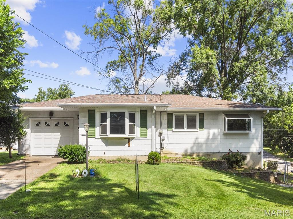 Charming Ranch with Great Curb Appeal & Spacious Yard. Welcome home to this well-maintained ranch offering timeless charm in a peaceful setting. This inviting home features three bedrooms on the main level and a large finished lower-level living area with a walkout to the backyard, providing flexible space for a family room, recreation area, or home office. The spacious, partially-fenced yard offers plenty of room for outdoor activities, gardening, or simply relaxing. Mature trees create a beautiful natural backdrop while adding shade and privacy. Enjoy outdoor entertaining or quiet evenings on the large rear deck featuring low-maintenance composite decking. Additional highlights include an attached one-car garage and a detached two-car garage with separate street access, providing ample parking, storage, or workshop space. Call your favorite Realtor for a tour today! Buyer to verify all listing information, including but not limited to square footage, room measurements, features, lot size, taxes, exemptions, schools, and all other pertinent details.