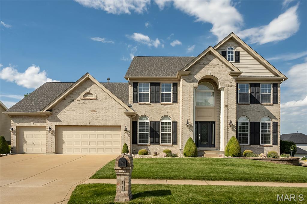 Welcome to 18 Kings Crossing Ct—where refined design meets everyday luxury in this stunning 1.5-story home located in the highly sought-after Mehlville R-IX School District. Offering 4 bedrooms, 2.5 baths, and over 3,450 square feet of thoughtfully designed living space, this residence delivers an exceptional blend of comfort, craftsmanship, and modern updates. 
Step inside to discover an inviting open floor plan enhanced by 9-foot ceilings and abundant natural light streaming through oversized 6-foot windows. The main level showcases newer solid hardwood flooring across the foyer, living, and dining rooms, setting an elegant tone throughout.
At the heart of the home, the fully updated chef’s kitchen is truly show-stopping—featuring a large center island, 42" custom cabinetry with crown molding, quartz surfaces, a 5-burner gas cooktop with pot filler, pantry, and a butler’s pantry with beverage cooler. Designed for both beauty and function, you’ll appreciate the abundant storage, deep drawers, pantry, and convenient slide-out shelving.
The main floor also offers a custom laundry room complete with quartz folding station and a drop zone, as well as a beautifully updated powder room. The spacious primary suite is a true retreat with a spa-inspired bath featuring an oversized shower with dual heads, center bench, dual vanities with quartz, and a custom-designed walk-in closet system.
Upstairs, a versatile loft provides additional living space, along with three generously sized bedrooms and a full bath—perfect for family or guests.
Outdoor living is equally impressive with full brick front elevation, a grand two-story arched entry, manicured landscaping with irrigation, solid block flower beds, and a tranquil pondless waterfall. Entertain or relax on the new TimberTech deck or expansive patio surrounded by a private backyard setting.
Additional highlights include:
Oversized 3-car garage | Walk-out lower level with bath rough-in—ready for future finish | New roof, gutters, fascia & downspouts (2025) |Newer appliances (2022) | Custom primary closet (2022) | Hardwood floors and Carpet (2020) | Updated half bath (2020) | Ventless gas fireplace |New shower doors & glass block window (2023)
This move-in ready home offers the perfect combination of luxury, functionality, and curb appeal in an established, desirable neighborhood—don’t miss your opportunity to make it yours.