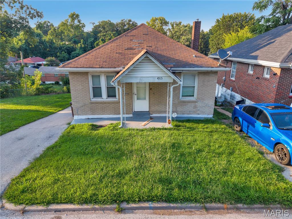 Weewoo weewoo! Investor friendly of first time home buyer alert. This classic square brick house has some solid bones rent ready finishes. Newer vinyl flooring  and refinished wood flooring throughout the main level, stainless steel appliances, washer/dryer in place, functional and clean bathroom make this ready for some cash flow. The house features a long driveway a long driveway culminating in a parking pad at the bottom. Interior photos and drone shots provided. Low expenses and high cash flow opportunity with tenants potentially paying all utilities outside of sewer for a certain amount. Sits on the top downward sloping hill so fun off is taken care of and doesn't come back into the house. You are minutes away from the Normandy shopping center (St. Louis county workforce, social security admin, Rent One, City Jump Family Entertainment Complex, etc.). Easy access to I-70 and get downtown within 20 min, Earth City within 15, and the airport in less than 10. This is part of a 13 unit single family portfolio sale all located around this area and at this price point. Can be sold individually or with the rest - See Supplements.
