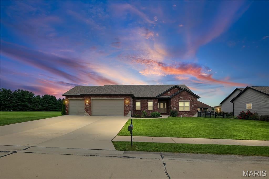 You WILL LOVE this almost NEW RANCH nestled in a cul-de-sac in the desired Canadian Crossing neighborhood.  This stunning home will INDEED IMPRESS!  Wonderfully designed with functionality in mind.  Stately foyer with open staircase, EYE CATCHING accent wall and STATEMENT LIGHTING will WOW you!  Fall deeper in love with the corner fireplace, vaulted ceilings, CUSTOM window treatments and an abundance of natural light.  Kitchen/dining area features a walk-in pantry, granite countertops with plenty of counter space, breakfast bar, and  UPGRADED APPLIANCES.  Split bedroom floor plan with nicely sized supporting bedrooms and a jaw-dropping PRIMARY SUITE (did we say AMAZING closet?) are added bonuses.  Unfinished basement allows you to DOUBLE THE SPACE and bring your own vision to life.  Storage GALORE.  Great fenced yard!  No need to mess with new construction, landscaping is completed.  3-CAR GARAGE!  Easy 45 minute drive to St. Louis-60 minutes to Springfield.  DON'T WAIT!  There is nothing like this in the Staunton school district!