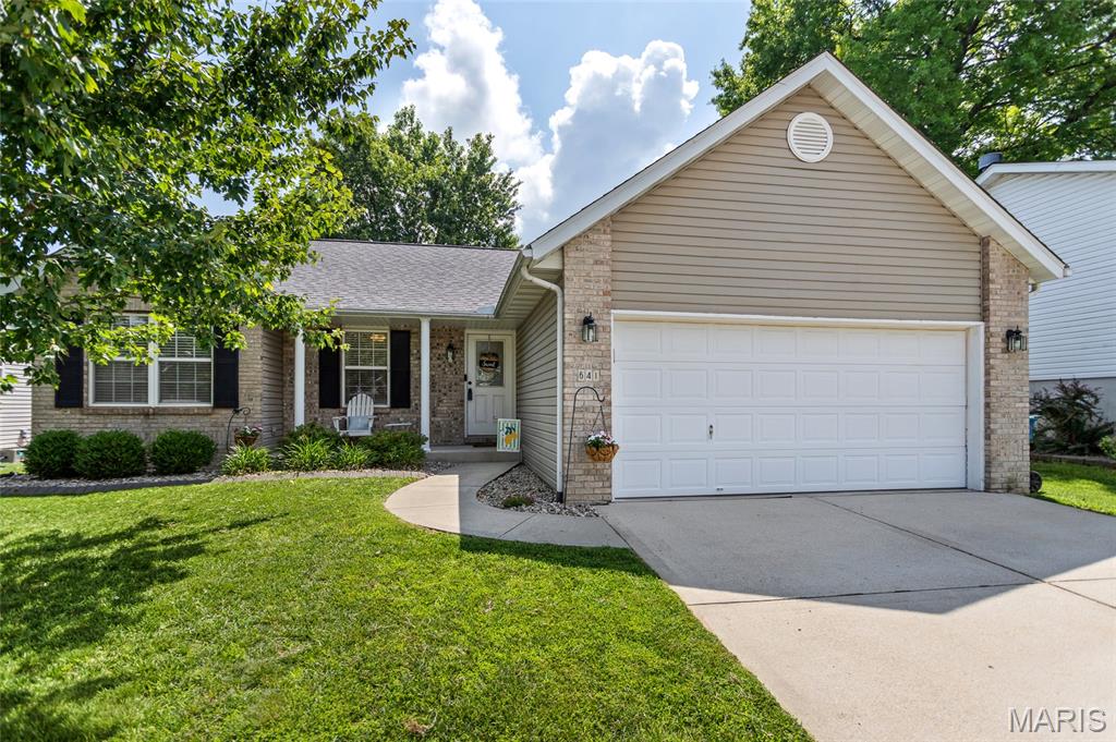 Welcome home to this beautifully maintained 3-bedroom, 3-bath home in the heart of Collinsville! Featuring an open and inviting floor plan, the spacious living room boasts vaulted ceilings and a cozy fireplace, creating the perfect gathering space. The kitchen offers a breakfast bar, large sink, ample cabinetry, and all kitchen appliances stay. The primary suite includes a double vanity and private bath for added comfort. The finished lower level provides incredible additional living space with new luxury vinyl plank flooring, a newer half bath, and a built-in bar complete with a kegerator and mini fridge that will remain with the home. A flexible bonus space offers the potential for a 4th bedroom, home office, gym, or recreation space. Outside, enjoy a private backyard featuring a vinyl privacy fence, back patio, and plenty of room to relax or entertain. The attached 2-car garage provides additional storage and convenience. An annual HOA fee of just $50 covers maintenance of the subdivision entrance and common ground areas. Washer and dryer also stay, making this move-in-ready home one you won't want to miss!