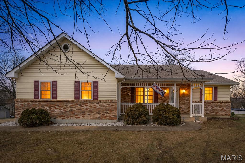 Welcome to this spacious 4-bedroom, 3-bath home located in the desirable Terre Du Lac community within the North County School District. Situated on a corner lot, this well-maintained one owner home offers comfort, functionality, and access to fantastic neighborhood amenities.  The main level features a comfortable master suite and convenient main floor laundry, making everyday living easy and accessible.  Beautiful Hardwood Floors.  The kitchen offers custom cabinetry, an eat-in dining space, and all appliances are included, providing both style and convenience. A separate dining area adds additional space for gatherings and entertaining.  The fully finished walkout basement greatly expands the living space with a large recreational area, wet bar, full bathroom, and a dedicated sleeping area—perfect for guests or extended family. You'll also appreciate the huge storage room for all your organizational needs.  Outside, enjoy the deck just off the back of the home, ideal for relaxing or entertaining. The property also includes a 2-car attached garage and a fully functional storage building for additional storage or workshop space.  Terre Du Lac offers outstanding amenities including swimming, fishing, boating, and access to a beautiful golf course, creating the perfect blend of community living and outdoor recreation.