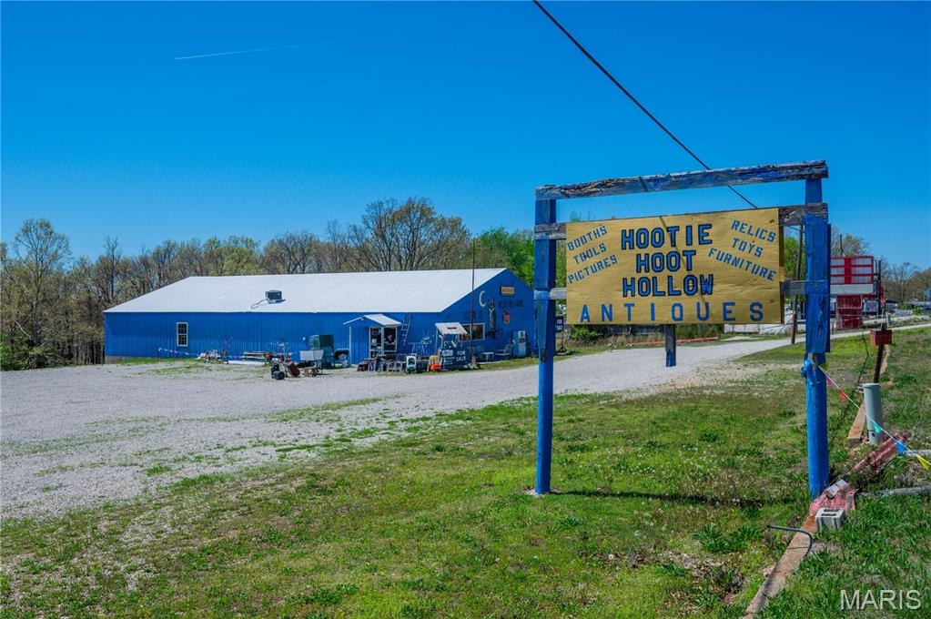 Welcome to Hootie Hoot Hollow! Situated just half a mile from the captivating Bennett Spring State Park, this exceptional commercial property spanning 4500 sq ft awaits your personal touch. Sitting on 2.34 acres and nestled along State Highway 64, only .5 mi away from Bennett Spring State Park, its prime location sets the stage for endless possibilities. Currently operating as an antique store, this versatile building can be transformed into anything. A restaurant, brewery, storage units, arcade, or even revived as a country music hall- reminiscent of its vibrant origins in the 80s. The property offers easy access for all, with its handicap accessibility features. While currently equipped with a single bathroom, the potential exists to convert it into four. The sky is truly the limit with this remarkable property, schedule your private showing today! Majority of contents can be purchased with property for $333k. A couple of vendor booths would be excluded.