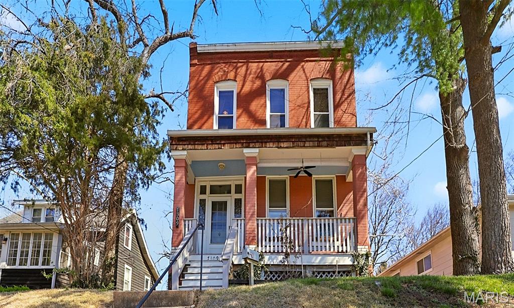 This enchanting historic century home, lovingly cared for by the same family for decades, offers a rare opportunity to add your own updates while preserving its timeless character. Once a duplex and now a spacious single-family residence, it welcomes you with a cozy covered front porch—perfect for morning coffee and quiet moments. Inside, the main floor features a gracious living room with a decorative fireplace, an inviting dining room, and a bright, roomy eat-in kitchen with abundant cabinetry that leads to a charming bonus space with built-in bookshelves—ideal for a home office or den—along with a full bath. Upstairs, you’ll find three comfortable bedrooms, an additional versatile bonus room perfect as a dressing room or sitting area, and a darling full bath. Outside, the large fenced backyard provides plenty of room for your furbabies’ zoomies, while the spacious deck awaits your patio lights and personal touches for starlit evenings. Though the home does not have central AC, it offers endless potential and a heartfelt history—ready for its next owners to fall in love and continue its story.