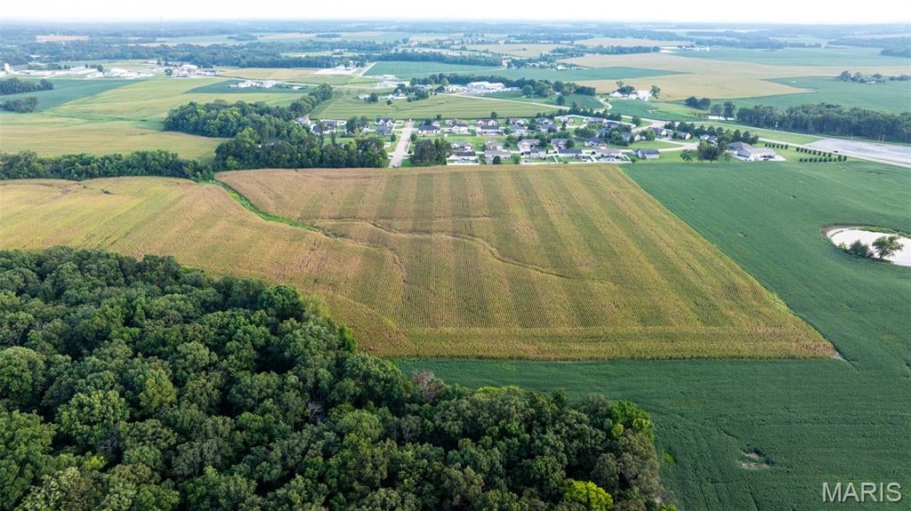 Located just south of Waterloo in Monroe County, Illinois, this 25.66+/- acre tract offers a development and investment opportunity in an established area with convenient access to Waterloo, the Metro East and the greater St. Louis area. The property is situated adjacent to Oak Valley Estates and has access from Pin Oak Drive, providing an existing connection to the surrounding residential area.

The property is currently being used for agricultural purposes, offering established land use while providing an opportunity for a future owner to evaluate development plans and infrastructure options. A previous preliminary plat has been completed for the property and can be shared with interested parties upon request. The preliminary planning provides a starting point for evaluating potential development concepts, subject to review and approval. During the previous planning period, the property has been re-zoned and is ready for development.

Access is available from Pin Oak Drive, with the property layout providing an opportunity for a future owner or developer to evaluate internal access and infrastructure placement. City water and other utilities are located near the property, which may provide options for connecting future improvements or development.

The property's location is one of its key features. Positioned just south of Waterloo and immediately adjacent to Oak Valley Estates, the acreage is surrounded by an established residential setting. Its proximity to Illinois State Route 3 provides convenient access and connects the property easily with Waterloo and communities throughout Monroe County, the surrounding Metro East. and greater St. Louis area.

Waterloo is the county seat of Monroe County and provides a range of local services, businesses, schools, restaurants, and community amenities. The property is located within the Waterloo school district, making the school district an important consideration for future planning and development. 

The property's location also provides access to the broader St. Louis area. The Metro East communities of St. Clair and Monroe counties are within convenient driving distance, while St. Louis, Missouri, is easily accessed as well. This combination of proximity to Waterloo, access to Route 3, nearby residential development, and connectivity to the Metro East makes the property well suited for further evaluation as a development or investment tract.

This property should be evaluated based on its development potential, location, access, surrounding land uses, and available infrastructure. Prospective buyers are encouraged to complete their own due diligence on any and all other factors affecting future use of the property.
