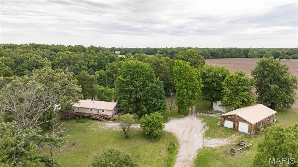 Must see lake property on 35 acres. Looking for a waterfront retreat or home??? This country setting home boasts beautiful lake views in a secluded setting. This property is ready for a new owners personal touch to transform this lake setting home into a pure waterfront retreat. This property boast a home, an estimated 4.5 acre lake, wooded acreage, multiple outbuildings and the seclusion that is hard to find. Appointment and viewings are only allowed through confirmed showings with an accompanied agent.