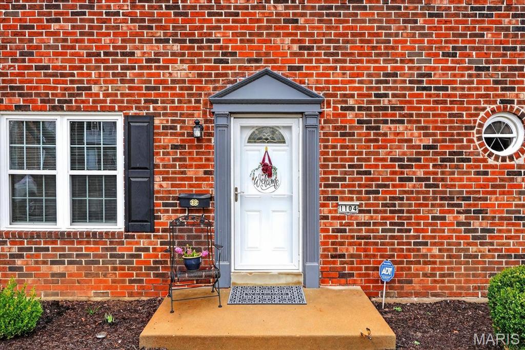 Absolutely adorable 3-bed, 2.5-bath, 1,736 sqft all-brick townhome. Ready to move in for sure! Fully remodeled with a spectacular kitchen!! Stainless appliances; fridge stays! Solid surface counters and lots of cabinet space, too! Tile backsplash. The kitchen opens to the den, which features a gas fireplace. The family room is sunken to give a greater feeling of space. Separate dining too! All the flooring is beautiful luxury vinyl. Large primary bedroom! A walk-in closet is organized to store all of your clothes.   Check out the room sizes! 2 more spacious bedrooms and another updated, full bath. Fresh Paint, carpet, and Windows! Full basement with laundry, Washer/Dryer stay! Private backyard with 6 ft privacy fence. 2 reserved parking spaces w/extra guest parking. Pool access, basketball & tennis courts. Exterior maintenance, water, sewer, trash & lawn care included! HVAC, HOT WATER, GARBAGE DISPOSAL  2 years. Sewer line repaired/fixed in 2022.