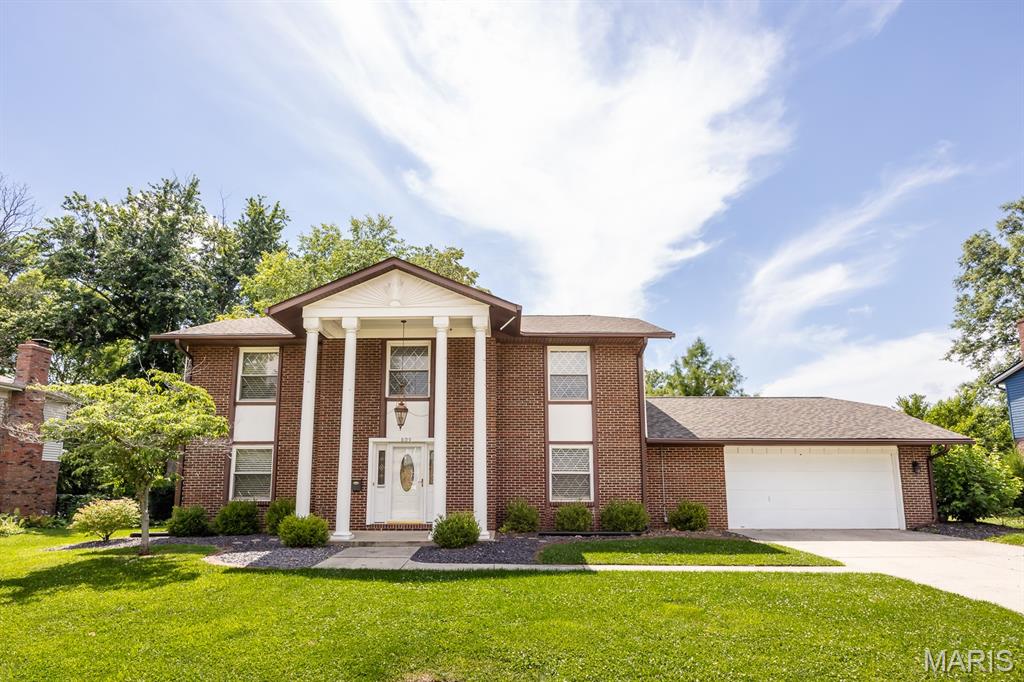 Located in the highly sought-after O'Fallon school district, this charming, character-filled traditional residence welcomes you home. Featuring a thoughtfully designed layout that embraces classic architecture, the home offers beautiful room separation and dedicated spaces for comfort and privacy. Fresh, new carpeting has been installed in the main-level home office and extends throughout the upper level. The main floor also boasts an elegant formal dining room, a cozy living room centered around a timeless fireplace, and a classic eat-in kitchen. Valuable modern updates bring absolute peace of mind, highlighted by a durable architectural shingle roof that is only 1 year old, a highly efficient tankless water heater for endless hot water, and a whole-house water softener. The attached two-car garage includes a generous extra room perfect for a dedicated workshop, hobby space, or seasonal storage. Step outside to find your own private retreat on the large back patio, serving as the perfect backdrop for summer barbecues, morning coffee, or simple relaxation. Offering 4 spacious upstairs bedrooms and 2.5 baths, this move-in-ready gem perfectly balances classic structure with premium functional updates.