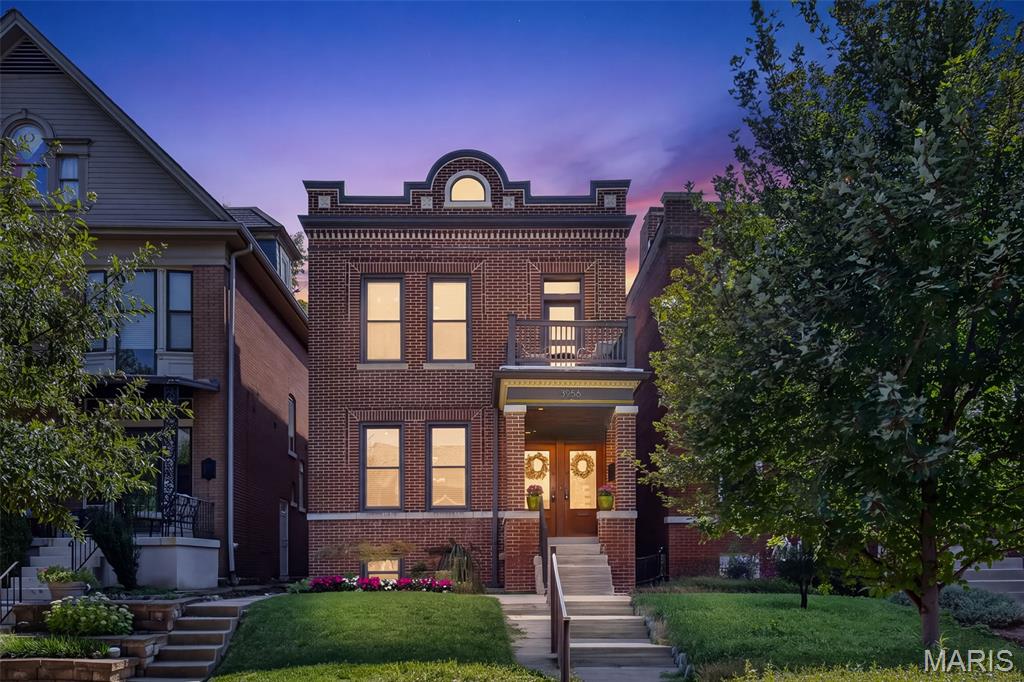 Beautifully updated and rich with historic character, this move-in-ready charmer blends luxury finishes with timeless architectural details in the red-hot historic Shaw neighborhood. Outside, you're greeted by an intricate brick facade and covered porch that highlight the classic double-door front entry. High ceilings, original hardwood floors, and detailed millwork set an elegant tone throughout the main level. The formal living features working pocket doors, perfect for creating a private home office. The layout flows into a spacious dining room that opens to the kitchen of your dreams! Top of the line features include a waterfall quartz island, stainless steel KitchenAid appliances, and a 6x6 walk-in pantry for all your big box store splurges. The bright and airy family room rounds out the main level. Out back you'll find the low-maintenance Trex deck with a private, fenced turf backyard (did we mention low maintenance?) Upstairs, the incredible primary suite offers a private Trex balcony, spa-like bathroom, and a spacious walk-in closet. Also upstairs are two additional bedrooms, a full bath, and a separate laundry room. The walk-out lower level provides a full unfinished basement with plenty of potential. Parking is a breeze in your detached 2-car garage with alley access. Located just minutes from Tower Grove Park and the Botanical Garden. Walk to grab a latte at Fiddlefern, a glass of vino at Sasha's, or a treat at Ices Plain & Fancy and visit this one at the first open house on Sunday, 9/6 before you miss it!