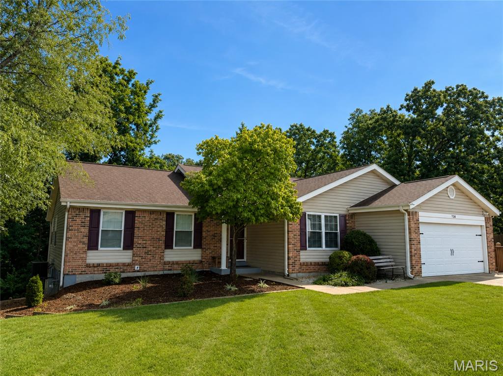 As you enter this 4-bedroom, 3 bath home you are greeted with a formal family/dining room with coffered ceilings and hardwood floors, this adjoins the open floorplan of the family room with a wood burning fireplace attached to the kitchen/ breakfast room with vaulted ceilings. The kitchen has the soft close 36in cabinets and a center island and pantry.   From the kitchen you open the sliding patio door that leads to the amazing 2 story deck that is perfect for entertaining and watching the beautiful sunsets.  The yard is beatifically landscaped.  Main floor laundry with a wonderful built-in storage.  The master bdrm has coffered ceiling & double closets .The basement features a family room, bedroom, full bath, a wet bar for entertaining, a workshop and plenty of storage. 2 car oversized heated garage w/ workshop