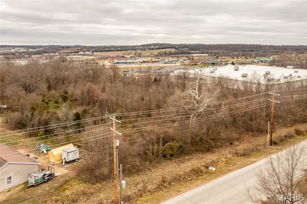 Property adjacent to Walmart. 3.49 acres of level land with 344 ft of Old Hwy 50 frontage. B2 zoning allows office and retail space. Location: City