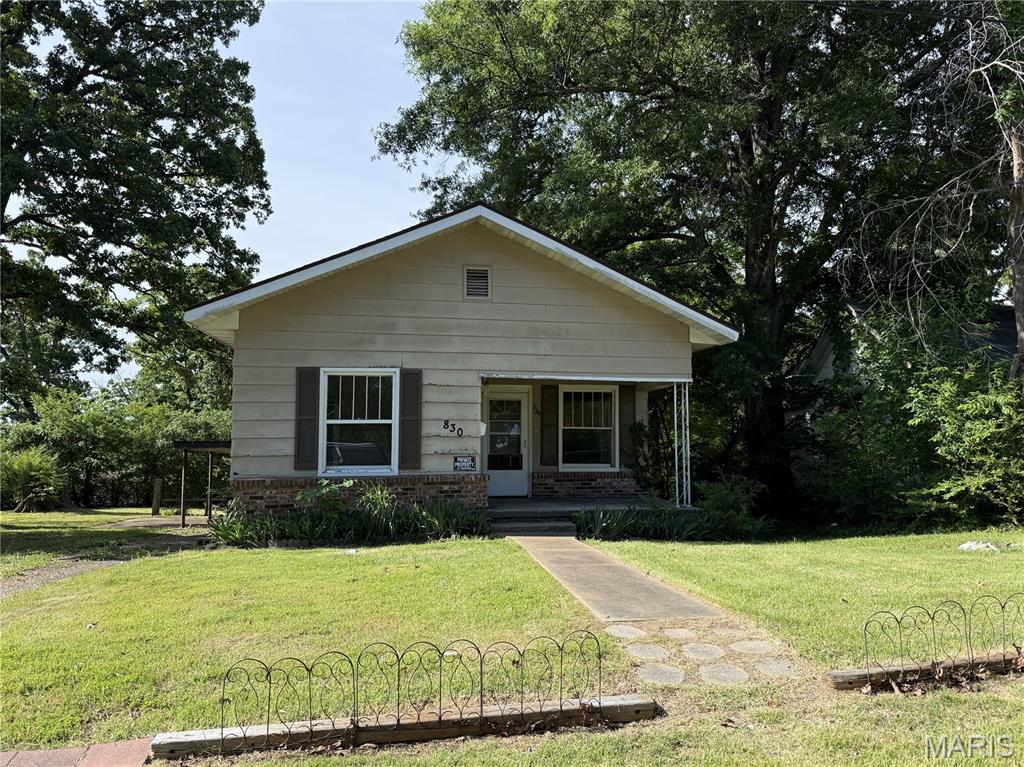 This adorable cottage has so much potential. Stepping on the cozy front porch and opening the door to a quaint living room, you will feel at home, and the visions of what could be will start to flow. This is the perfect fixer-upper with a large lot and a nice backyard.