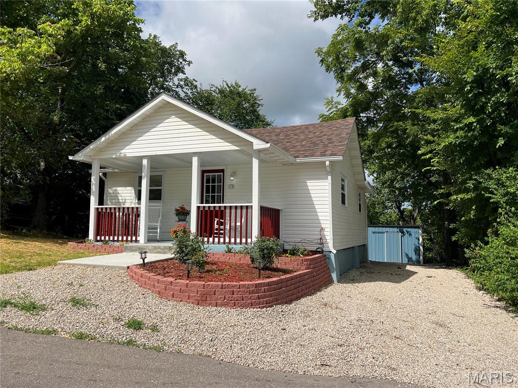 Enjoy one of the best downtown views in Waynesville from this beautifully updated 2-bedroom, 2-bath home overlooking downtown. Inside you’ll find a bright, move-in ready interior featuring luxury vinyl plank flooring, an inviting living room with an electric fireplace, and an updated kitchen with quartz countertops, stainless steel appliances, tile backsplash, and plenty of cabinet space. Both bathrooms are spacious and feature beautiful stone countertops. Step outside to relax on the covered front porch, entertain on the rear deck, or take advantage of the detached outbuilding complete with an attached carport—perfect for storage, hobbies, or extra workspace. Conveniently located just minutes from shopping, dining, schools, and Fort Leonard Wood, this home offers the perfect combination of comfort, convenience, and scenic views. Available fully furnished if desired, just pack your suitcase!