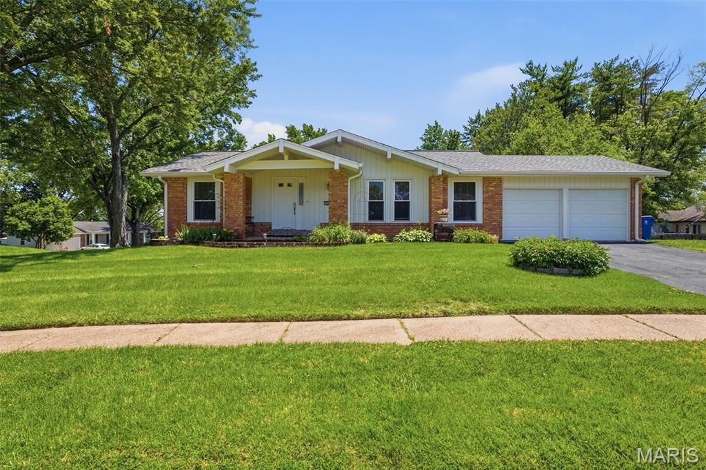 Located in a desirable neighborhood where homes rarely come on the market, this well-maintained and updated 3 bedroom/2.5 bathroom ranch offers the perfect blend of comfort, functionality, and space for today's family lifestyle. Step inside the entry foyer leading into the spacious living and dining room combination with plenty of room for family gatherings and holiday celebrations. The updated eat-in kitchen offers newer cabinetry, abundant space and stainless steel appliances. Just off the kitchen, the inviting family room features a fireplace & sliding glass door that opens to a large deck, creating the perfect setting for summer barbecues, outdoor dining, and entertaining friends and family. The main level includes two generously sized guest bedrooms, a full hall bath, and a comfortable primary suite complete with an updated private bathroom. Main level features window blinds, wood and tile flooring and plenty of windows allowing an abundance of light throughout. The finished walkout lower level expands your living space even further with a large great room featuring a built-in bar, making it ideal for movie nights, game days, or hosting gatherings. You'll also find an office or potential fourth sleeping room, a utility room with laundry area, and a convenient half bath. An attached two-car garage provides convenience and additional storage. Outside, the corner lot offers plenty of room for kids or pets to play while providing space for gardening, recreation, or simply relaxing outdoors. With its desirable location, spacious floor plan, numerous updates, and family-friendly features, schedule your private showing today before this rare opportunity is gone!
