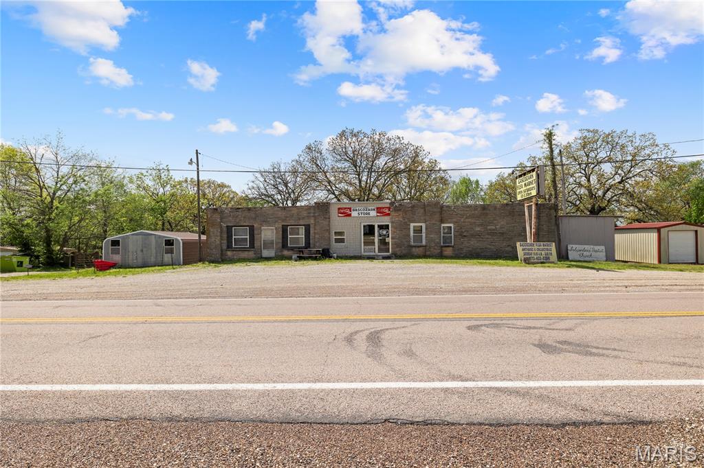 Historic Route 66 opportunity in Richland, Missouri! Located at 30570 Highway AB just off I 44, this recognizable property offers outstanding visibility, easy access, & a unique chance to bring new life to a landmark style building with classic roadside character. Currently being used as a flea market, the property is ideal for an investor, entrepreneur, collector, Route 66 enthusiast, or anyone looking for a fixer upper commercial project with history & potential.

The building features a distinctive native stone exterior, flexible interior layout, & multiple outbuildings included with the sale, offering additional space for storage, inventory, vendor overflow, workshop use, or future creative possibilities. With its proximity to Historic Route 66, I 44, & the surrounding Richland area, this property offers a rare blend of nostalgia, location, utility, & future upside.

This is an inherited property & is being sold as is/where is. That means ALL of the nostalgic collectables and antiques go with the property! Seller makes no guarantees regarding condition, systems, square footage, outbuildings, zoning, permitted uses, or future use, and the price reflects that. 

Bring your vision, your contractor, & your imagination. Properties with this kind of Route 66 character & added outbuilding space do not come around often.