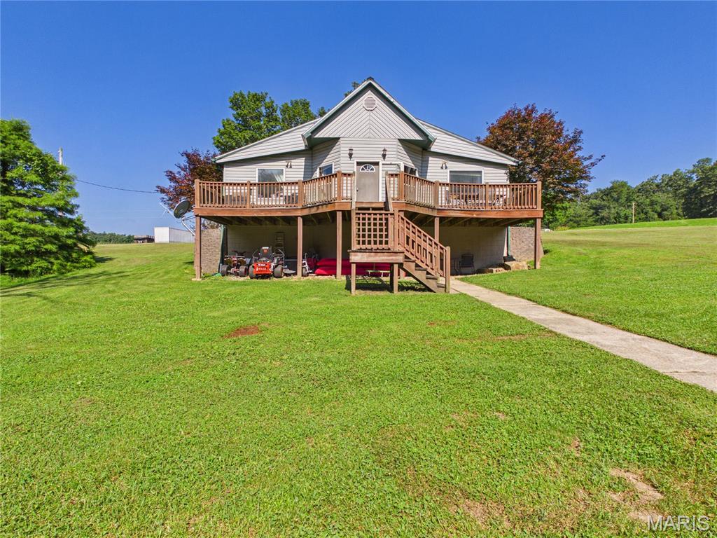 Nestled on nearly 3 peaceful acres just outside of town, this 3-bedroom, 1-bath home offers the privacy and space you've been looking for. Enjoy your morning coffee on the front deck or unwind in the evenings on the back patio while taking in the quiet country setting. Whether you're looking for your next home, an investment opportunity, or a property to make you own, this one has plenty of potential. Being sold AS-IS, this property is ideal for buyers and ready to add their personal touch and build equity. If you've been search for affordable acreage with endless possibilities, don't let this opportunity pass you by.