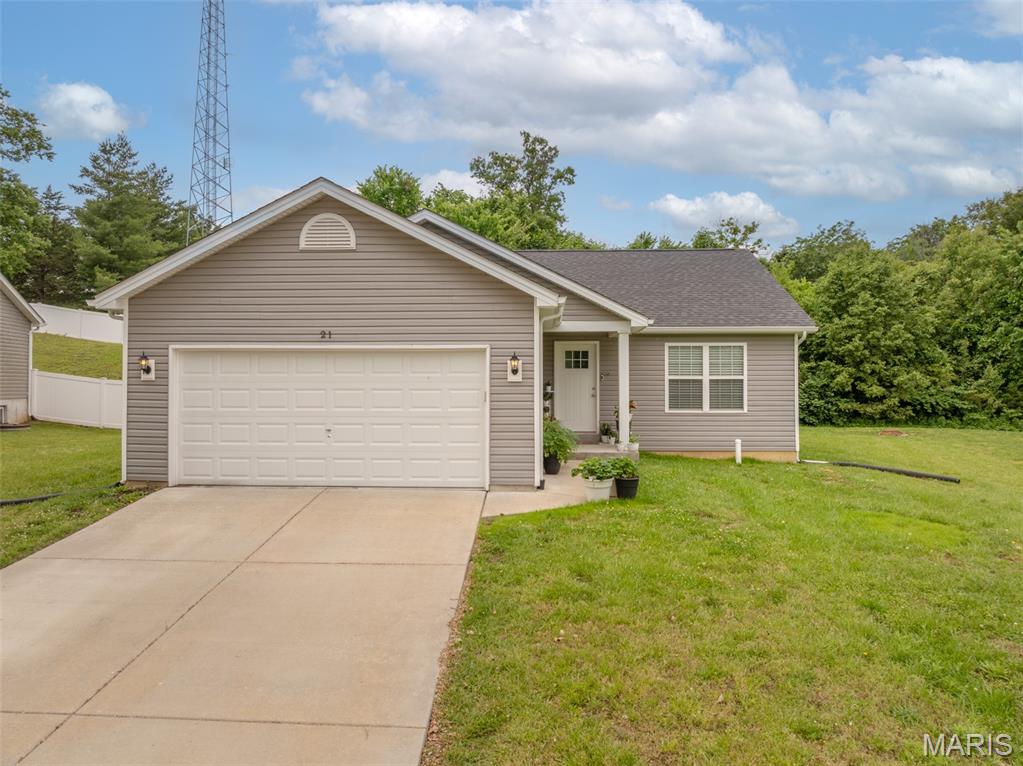 Move right in and enjoy this beautifully maintained ranch home backing to a tree line for added privacy. Built in 2020, this 3-bedroom, 2-bath home offers an open floor plan filled with natural light, vaulted ceilings, and luxury vinyl plank flooring throughout the main living areas. The kitchen is designed for both everyday living and entertaining, featuring granite countertops, abundant white cabinetry, stainless steel appliances (refrigerator is included), a center island with breakfast bar seating, a walk-in pantry, and additional storage space. The private primary suite offers a walk-in closet and full bath, while two additional bedrooms provide flexibility for family, guests, or a home office. The full unfinished lower level is ready for your future plans with rough-in plumbing for a third bathroom, an egress window, and plenty of space for additional living area. Conveniently located near Highway 47 and just minutes from Cuivre River State Park, this home combines peaceful surroundings with easy access to everyday conveniences. USDA financing eligible for qualified buyers.