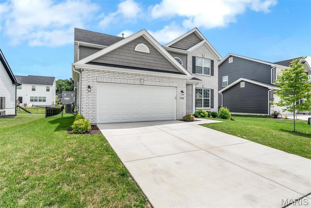 Why wait to build when this beautiful, move-in-ready 2-story home is ready now? Offering 4 bedrooms, 2.5 baths, and over 2,000 square feet of thoughtfully designed living space, this home combines modern style with everyday functionality. The open floor plan features durable wood-look flooring throughout the main level, abundant natural light, and a spacious family room perfect for gathering with family and friends.
The kitchen is the heart of the home, boasting quartz countertops, a center island with breakfast bar, 42-inch cabinetry, stainless steel appliances, a walk-in pantry, and an adjoining breakfast room with sliding glass doors leading outside. Step onto the expansive composite deck overlooking the fully fenced backyard—ideal for entertaining, relaxing, or letting pets and children play safely. A dedicated pad is already in place for a future hot tub, creating the perfect space for outdoor enjoyment.
A formal dining room provides additional room for hosting guests, while the convenient main-floor laundry and powder room add everyday practicality. Upstairs, the spacious primary suite offers a walk-in closet and private bath featuring double vanities, a walk-in shower, and soaking tub. Three additional bedrooms and a full hall bath provide plenty of space for family, guests, or a home office.
The full basement with an egress window and a bath rough-in offers endless opportunities for future finishing and additional living space. Located in desirable Polo Grounds Manors within the Rockwood School District, this home offers the perfect blend of comfort, style, and convenience.