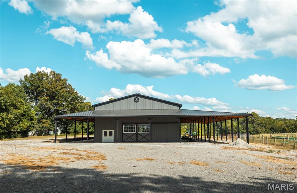 Welcome to this 90 acre +/- well designed cattle farm nearby the city limits of Alton, IL. This farm offers a combination of fenced pastures, alleyways, automatic waterers, feed bunks, hay fields, and outbuildings. The  main barn is over 5,000 sq ft and includes a large storage space, kitchenette, 2 bathrooms, living quarters, and a substantial wrap around awning. A hoop barn is nearby for sufficient hay or equipment storage. Interstate 255 and Homer Adams Parkway are within just a couple miles either way, allowing for easy commutes and access to amenities.