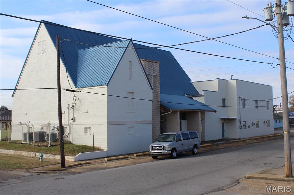 Looking to expand or move your church location?  This 12351 square foot building has numerous updates including new roof over the gym, two newer heat and air units, new carpet, inside and exterior paint.  This commercial building could be multiunit apartments with common areas, residential care facility, church, and/or a school; with 9 classroom size rooms, 5-8 office or storage rooms, besides the 67x35 sanctuary w/loft, and 46x37 gym.  There are also 2 working kitchens and 3 different restrooms.  Some of the equipment and chairs will stay with the sale.  Small single family property behind building is negotiable.