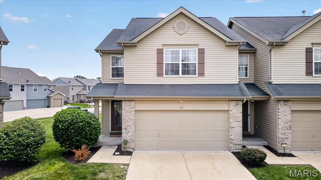 Beautifully updated 3 Bedroom, 2.5 bath end-unit townhome in highly sought-after Countryshire! Located in O'Fallon with a Lake St. Louis mailing address, this move-in ready home offers the perfect blend of space, style, and convenience. Fresh neutral paint, updated plank flooring throughout the main level, and a custom feature wall in the second bedroom create a warm, modern feel. The open floor plan features a spacious living area, breakfast bar, upper-level laundry, and a private patio backing to common ground. The primary suite offers dual walk-in closets and a luxury bath with double vanities, separate tub, and shower. The finished lower-level rec room adds valuable living space with recessed dimmable lighting and a cozy electric fireplace—perfect for movie nights, a home office, or game day gatherings. Enjoy a 2-car garage and low-maintenance living in one of the area's most desirable communities. Countryshire residents enjoy access to a neighborhood pool, lake, walking trails, playground, basketball court, tennis/pickleball court, and community events. Conveniently located near shopping, restaurants, parks, and major highways in the highly rated Wentzville School District, including Liberty High School.