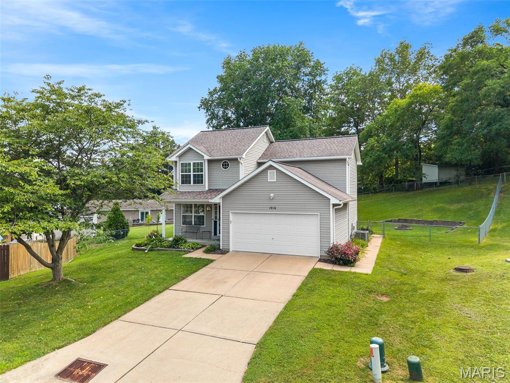 Proudly offered by it's original owner, this meticulously maintained home showcases what true pride of ownership is all about. This three bedroom residence nestled on a quiet cul de sac has been lovingly maintained and thoughtfully cared for over the many years. Inside you will find gleaming hardwood floors ,that look brand new, adding character and warmth throughout the home. The inviting eat-in kitchen is thoughtfully appointed with stainless steel appliances, providing a functional and appealing space for culinary endeavors. Bright and cheery, spacious family room.  Primary bedroom hosts an updated bath en suite.  Two more bedrooms and another exceptionally updated full bath finish off the upstairs.  Enjoy additional living space in the finished walk-out lower level, offering endless possibilities for a recreation area, home office, craft space, etc.  Step outside on the patio to take in the peaceful surroundings while enjoying the privacy and charm this wonderful home has to offer .  Outside, a private yard provides a personal retreat, complemented by a fire pit for evening gatherings and a patio for outdoor enjoyment. All while a welcoming porch enhances the home's curb appeal. Located in close proximity to the quaint little town of Kimmswick where small town feel of shopping, sipping on wine and dining make your heart swell.  This property presents an opportunity to embrace a comfortable and engaging lifestyle; schedule your viewing today.