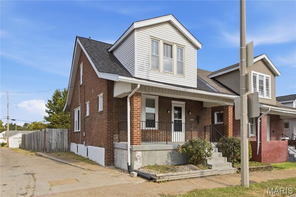 This south city 1036/1200 mostly brick square foot two story offers tons of captivating features for your buyers. The charming home has two larger bedrooms, two modern full bathrooms and another finished bonus room in basement with attached bathroom.  New school updates with white cabinets, stainless appliances, refrigerator, fresh neutral paint, and recessed lighting. Still lots of old school character with 8 inch baseboards, cove molding, arch doorway from dining room to living room and tall ceilings. Updated systems include four year old sewer lateral line replacement, newer electrical panel, new air conditioner, most vinyl window replacements and newer furnace. Move outside and find the spacious front porch, covered back deck, basement walk out, and fenced back yard. Corner lot with street parking, alley access beside home and additional parking behind wood fence. Schedule showing as your buyers will love this home!