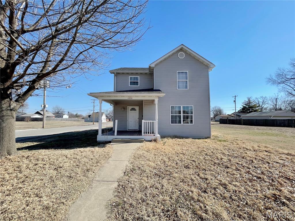 Welcome to this spacious two-story home situated on a corner lot in the heart of Madison! This property offers a functional layout with plenty of space for comfortable living. The covered front porch provides a warm welcome and leads into a small entry foyer that opens to the living room. The main floor features a private primary suite complete with a full primary bathroom, offering convenient main-level living. The kitchen and dining room combo provide an open gathering space with easy flow, along with a half bathroom for guests and access to the attached 2-car garage. Upstairs, you’ll find two additional bedrooms, a full bathroom, and a dedicated laundry room for added convenience. A partial unfinished basement offers extra storage space and potential for future finishing. Located just minutes from Granite City and downtown St. Louis, this home provides easy access to major highways including I-270 and I-255, making commuting simple. Nearby amenities include shopping, dining, and outdoor recreation. With its corner lot location, attached garage, covered porch, and practical floor plan, this home offers great space and convenience. Schedule your showing today! ALL information is deemed reliable but is not guaranteed and should be verified by the buyer and/or buyers agent before making an offer.