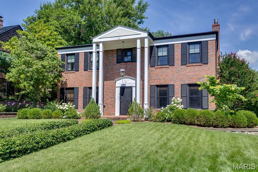 Welcome to 26 Granada Way, a beautifully maintained brick colonial tucked into the heart of Ladue's coveted La Hacienda neighborhood. Framed by mature trees, manicured hedges, and a classic brick walkway leading to a columned front portico, this home makes an unforgettable first impression.

Step through the elegant front door into a traditional center-hall floor plan that unites formal and informal living with effortless flow. A gracious dining room awaits your gatherings, while the spacious living room offers wonderful proportions for entertaining or quiet evenings at home. The well-appointed kitchen serves as the heart of the home, connecting easily to both the dining room and the comfortable family room. A convenient main-floor bath and access to the oversized two car garage round out the main level. Well maintained and efficient, this home reflects true pride of ownership throughout.

Upstairs, the primary bedroom is exceptionally large, offering a true retreat at the end of the day. Two additional generously sized bedrooms and two full baths complete the second floor, with a thoughtfully laid out hall providing easy access. The full basement offers abundant space for storage, a workshop, or future finished living area, the possibilities are endless!

Outside, the private, park like backyard is a showstopper. Tiered stone retaining walls step down to a sprawling level lawn shaded by towering, mature trees, creating a peaceful, secluded setting for outdoor entertaining or simply enjoying nature. A brick patio area off the rear of the home offers additional space to relax, while the classic brick exterior, crisp white trim, and black shutters carry the same timeless character found throughout the front of the home.

Tucked into the tree lined streets of La Hacienda, one of Ladue's most sought-after enclaves, this home places you just minutes from Ladue's top rated schools, the shops and restaurants of Clayton, and quick access to Highways 40 and 170 for an easy commute anywhere in the metro area, close to everything Ladue has to offer.

Thoughtful improvements, solid construction, and a layout that works for everyday living all combine to make this a surprisingly rare and exceptional opportunity.  True gems like this don't come to market often, schedule your private showing today!