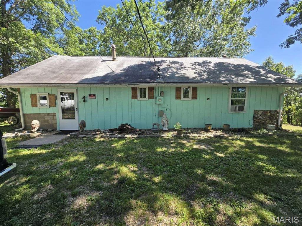 Private Lake-Area Retreat on 9.6 Acres — Blue Waters Community!
Sold furnished! Escape to your own slice of the Ozarks with this 1,376 sq ft home tucked into 9.6 wooded acres in the sought-after Blue Waters lake community, just minutes from the Gravois Arm of Lake of the Ozarks and a nearby public boat ramp. Bring the boat, the UTV, and the whole crew — this is the recreational getaway you've been waiting for.
Inside, a soaring vaulted great room with an open loft creates a bright, airy gathering space, anchored by a cozy wood stove for those crisp lake-country evenings. The functional kitchen, comfortable bedrooms, and full bath make it move-in ready as a weekend retreat, full-time residence, or rental. Step out onto the expansive wood deck to take in the peace and privacy of the surrounding timber.
Major pieces are already in place: durable metal roof, well and septic, electric forced-air heat plus the wood stove, carport, and multiple outbuildings for storage, gear, or a workshop. Mature trees, wildlife, and room to roam round out the package — all on nearly 10 private acres.
Properties with this much land in a lake-access community don't come around often. Whether you're hunting, fishing, riding trails, or simply unplugging, this one delivers. Available for showings today!