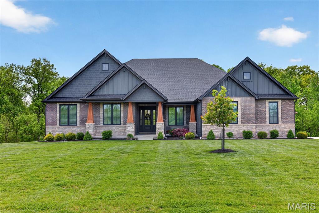 Looking for the perfect multi-generational home or private in-law suite with its own entrance? This custom-built Lombardo Ranch on 5.44 acres checks every box. Thoughtfully designed with high-end upgrades throughout, this home blends style, comfort, and function in every detail.
On the main level, you’ll find a chef’s kitchen featuring white custom cabinetry, quartz countertops, a striking stone arch over the cooktop, and premium appliances. Floor-to-ceiling windows flood the open living area with natural light, accentuating the hardwood floors, soaring ceilings, and custom finishes. The main level also includes the primary ensuite and two additional bedrooms, plus designer details such as smart-home technology, custom closets, and even a private cocktail lounge. The lower level lives like its own home, offering a full luxury kitchen, spacious living room, private study, and an additional primary suite—all with its own separate entrance. Perfect for multi-generational living, guests, or extended stays. Step outside to enjoy the serene setting—whether you’re relaxing on the covered cedar deck, unwinding on the patio, or envisioning a future pool in the private, level backyard framed by mature trees. All this, just minutes from wine country and within 10 minutes of the Hwy 40 corridor. This will become a gated community this spring/summer!