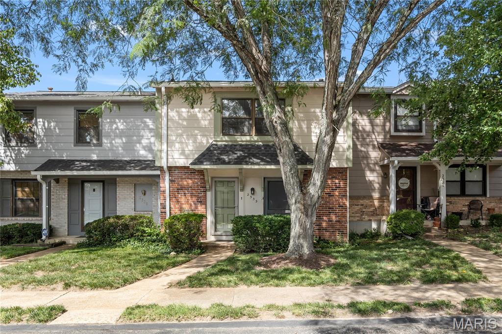 Move right into this charming townhouse offering comfort, style, and a serene setting. The main level features newer hardwood flooring throughout and an inviting open-concept layout.  The kitchen showcases natural wood cabinetry, stainless steel appliances, a tile backsplash, and an eat-in dining area perfect for everyday living.  A formal dining area is right off of the kitchen for holidays and family gatherings.  The cozy family room includes a gas log fireplace and large sliding glass doors that open to a private wood deck overlooking a peaceful, tree-lined backdrop.  Upstairs, you’ll find a spacious primary suite with a full bath and walk-in closet, along with two additional bedrooms that share a well-appointed full bathroom. The upper level features brand-new carpeting and the entire home has been freshly painted, making it truly move-in ready.  The partially finished lower level offers a generous laundry area conveniently located next to the oversized one-car garage, providing excellent storage options.  Community amenities include a clubhouse, swimming pool, and tennis courts. Ideally located near shopping, dining, and everyday conveniences—this home is one you won’t want to miss!
