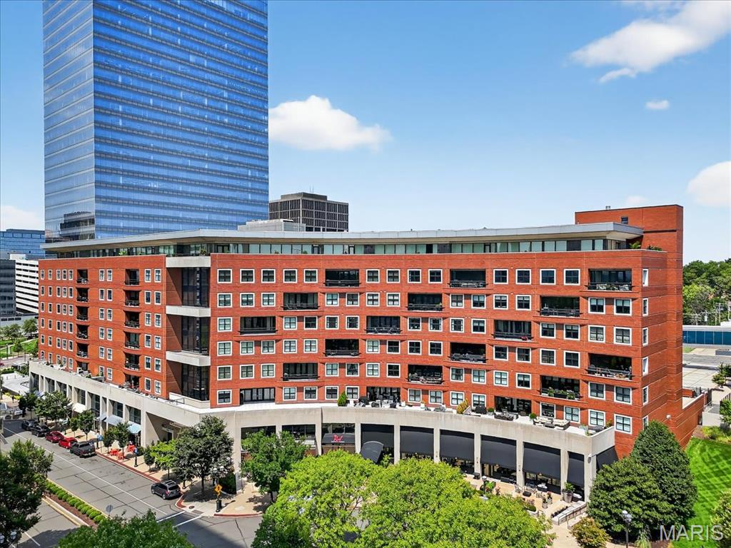 A rare opportunity to own a stunning 4-bed condo in the exclusive The Crescent, located in the heart of downtown Clayton. This 6th-fl residence offers sweeping views of Clayton and the St Louis skyline from 2 inset balconies. An expansive open floor plan with 9-10 foot ceilings, floor-to-ceiling windows, and high-end finishes throughout. Rich wood floors, custom built-ins, and gas fireplace create an inviting ambiance. The gourmet eat-in kitchen with Wolf and SubZero appliances flows into the spacious dining and family rooms, perfect for entertaining. The luxurious primary suite features 2 custom closets, remote operated shades, and a spa-like bath. 3 additional beds with ensuite baths provide ultimate comfort and privacy. Addtl. highlights include an office, sitting rm, 2 laundry rms, and 4 parking spaces. Enjoy world-class amenities such as a fitness center, concierge, dog park, secure heated garage, 24-hour doorman, valet, onsite manager, moments from fine dining and shopping. Location: Interior Unit