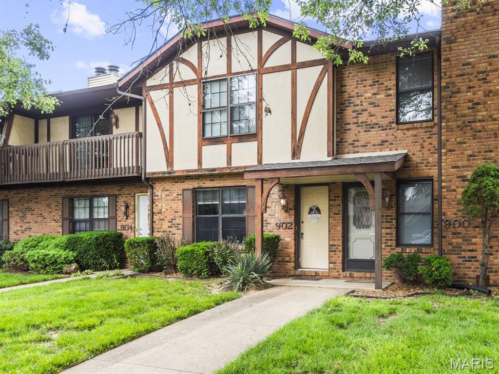 Low maintenance affordable living in the heart of O'Fallon. This move-in-ready home has just been freshly painted with new carpet installed in the bedrooms too. Main level features a well laid out kitchen including dishwasher, refrigerator, stove, and plenty of countertop space, plus an extra dining area with easy access to the 2-car carport. Main level has a washer and dryer area, plus a half bath. You'll love the living room with corner wood burning fireplace. Upper level has 2 large bedrooms, one with double closets, plus a full bathroom.  Enjoy someone else handling the exterior maintenance, lawn care, and snow removal. Extra storage shed too. Other updates: new blinds, building roof was installed in 2025. Call your favorite Realtor for a tour today!
