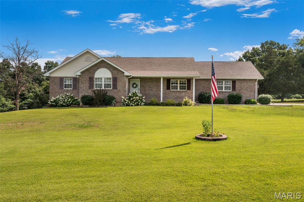 Beautifully maintained and move-in ready, this 4.45± acre property offers the perfect combination of comfort, space, and functionality! Built in 1997, the home features 1,352± sq. ft. on the main level with a welcoming floor plan designed for both everyday living and entertaining. The spacious master suite offers excellent closet space and a private ensuite bath, while two additional bedrooms, a full bathroom, and a dedicated laundry area provide convenience for the entire family. Just off the living room, you’ll find a back deck overlooking the property — the perfect spot to relax or enjoy time outdoors. An enclosed staircase leads to the fully finished basement featuring a large family room, game room, additional sleeping or storage space, mechanical room, and an oversized bathroom that truly stands out. Double patio doors provide easy access to the backyard and patio area. A short walk from the home leads to an incredible detached maintenance/workshop building complete with ample storage, garage door access, workbenches, and plenty of wall space for tools, equipment, hobbies, or projects. Outside, the property is beautifully landscaped with a sprawling yard that offers endless opportunities for recreation, gatherings, and enjoying country living — all conveniently located off state highway frontage and  just minutes from downtown Fredericktown!