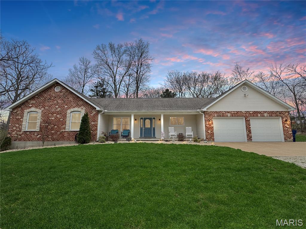 Just what you have been waiting for in Union, MO! A stunning ranch home on approximately 3 private acres at the end of a quiet cul-de-sac—your own peaceful retreat. The home features a beautiful brick and stone front, a welcoming covered front porch, a walk-out patio, an oversized 2-car garage with additional storage space ( fits a large truck or boat), and a charming detached shed. Enjoy relaxing on the spacious front porch while listening to the birds sing and taking in the private setting. Inside, the home offers a large entry foyer that opens to a great room with vaulted ceilings, a cozy wood-burning fireplace, and accent windows on each side of the fireplace that fill the room with natural light. The kitchen is stunning, featuring quartz countertops, high-quality appliances, and ample cabinet space. Just off the kitchen and garage entry is a large laundry room with sink and convenient half bath for guests. The main level includes a spacious primary bedroom with a luxury bath ( whirlpool tub & seperate water closet with shower), two additional bedrooms, and a full hall bath. The walk-out lower level offers even more living space with a large family room, recreation area, additional bedroom, full bath, and plenty of storage space in the unfinished area, with more potential for living space.  Updates and features: 2X 6 walls, Roof 2017, wood floors refinished 2021, 2 stage heat pump system, and quartz counter tops 2021. Home is approx. 2797 sq ft total living space with 4 bedrooms and 3.5 bath.  This home and private setting are truly a must-see. Don’t miss this opportunity to own the property you’ve been waiting for!