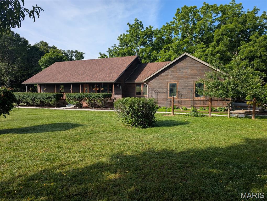 Take a step into peaceful country living with this charming two-bedroom, one-bath farmhouse nestled on 16.48 beautiful acres. Surrounded by mature trees, open pasture, and peaceful scenery, this property is the kind of place where you can slow down and truly enjoy the simple things in life. From the moment you pull in, the manicured landscaping and welcoming curb appeal make you feel right at home.
Sit back and relax on the huge covered porch while enjoying the quiet countryside views and fresh air. Inside, you’ll find beautiful hardwood floors, a cozy sunroom filled with natural light, and a spacious bathroom featuring a classic clawfoot tub full of farmhouse charm. The home offers plenty of space and warmth with a comfortable country feel throughout.
Outside is where this property truly shines. The massive 60x100 barn with five stalls is ready for horses, livestock, equipment, or your dream hobby farm. A second charming barn adds even more character and functionality, along with multiple storage buildings for all your tools and toys. There is also a mobile home on the property that would make excellent storage or provide additional possibilities.
Enjoy evenings by the large pond, tend to your garden space, and harvest from the many fruit trees scattered throughout the property. With room to roam, farm, ride, or simply relax, this property offers endless opportunities for anyone wanting a peaceful country lifestyle.
Whether you're looking for a hobby farm, a private retreat, or a place to enjoy the beauty of rural living, this one has the space, charm, and setting to make it truly special.