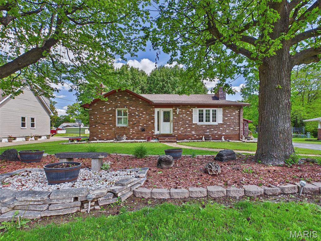 Charming all brick home nestled in a quiet, established neighborhood. This well-maintained property offers two bedrooms and two full bathrooms, plus a non-conforming third bedroom in the partially finished lower level.  You'll find ample storage throughout, including double closets in each of the bedrooms and hallway.  The lower level features a dry bar, laundry area and storage room with built in shelving.  Step outside to a serene outdoor retreat with an atrium style covered 16x42 patio overlooking the generously sized yard - perfect for relaxing and entertaining. The backyard also includes and additional storage shed and charming kids' playhouse.  Car enthusiasts and hobbyists will appreciate the two oversized heated garages with total space for 6 vehicles, full bath and workshop.