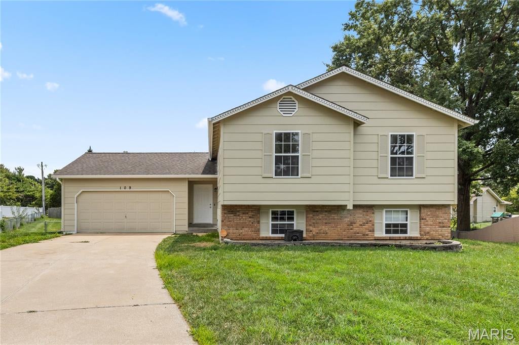 Welcome to 109 Golden Harvest Court, a beautifully updated 4-bedroom, 2-bath home offering approximately 1,707 square feet of comfortable living space on a spacious 0.42-acre lot. Step inside to discover a bright, open interior featuring fresh paint throughout and new luxury vinyl plank flooring. The updated kitchen showcases new cabinetry, granite countertops, stainless steel appliances, and plenty of workspace for everyday living and entertaining. Vaulted ceilings and abundant natural light enhance the open living and dining areas. The finished lower level provides additional flexible living space suitable for a family room, recreation area, or home office. Outside, enjoy the new deck overlooking the generous backyard—perfect for relaxing, entertaining, or outdoor activities. Additional highlights include four well-sized bedrooms, two full bathrooms, and an attached two-car garage. Conveniently located in St. Peters within the Francis Howell R-III School District, this move-in-ready home combines modern updates, functional living space, and an impressive lot. Schedule your private showing today!