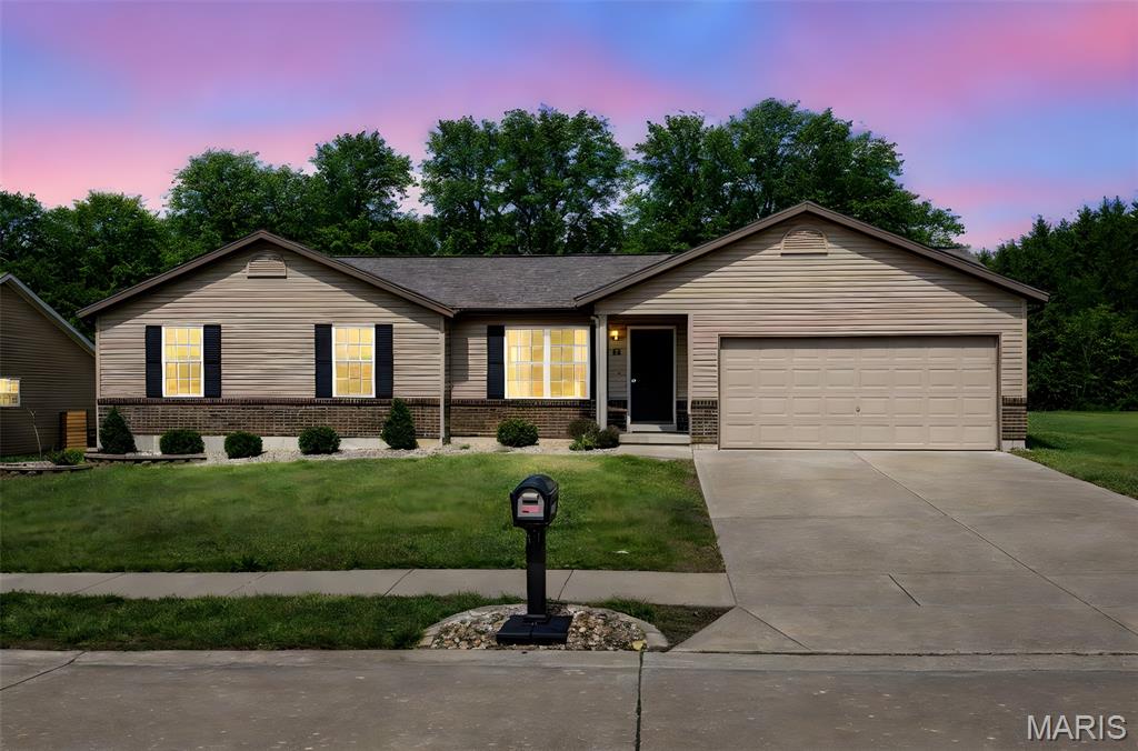 Welcome home to the peaceful views and easy living! This charming 3-bedroom 2-bath ranch offers a desirable open floor plan with vaulted ceilings and vinyl flooring throughout the main living areas. The spacious kitchen features lots of cabinet space perfect for gathering and entertaining while seamlessly connecting to the living and dining spaces. The primary suite has a private full bath. This home offers a main floor laundry room that is right off the kitchen with room for a drop zone, shoe cubbies etc. The unfinished lower level is equipped with a full rough in to finish an additional bathroom and an egress window for a true additional bedroom. Just bring your ideas to make it your own.  Step outside to enjoy the flat level backyard with serene views of open farmland so no rear neighbors just peaceful scenery.