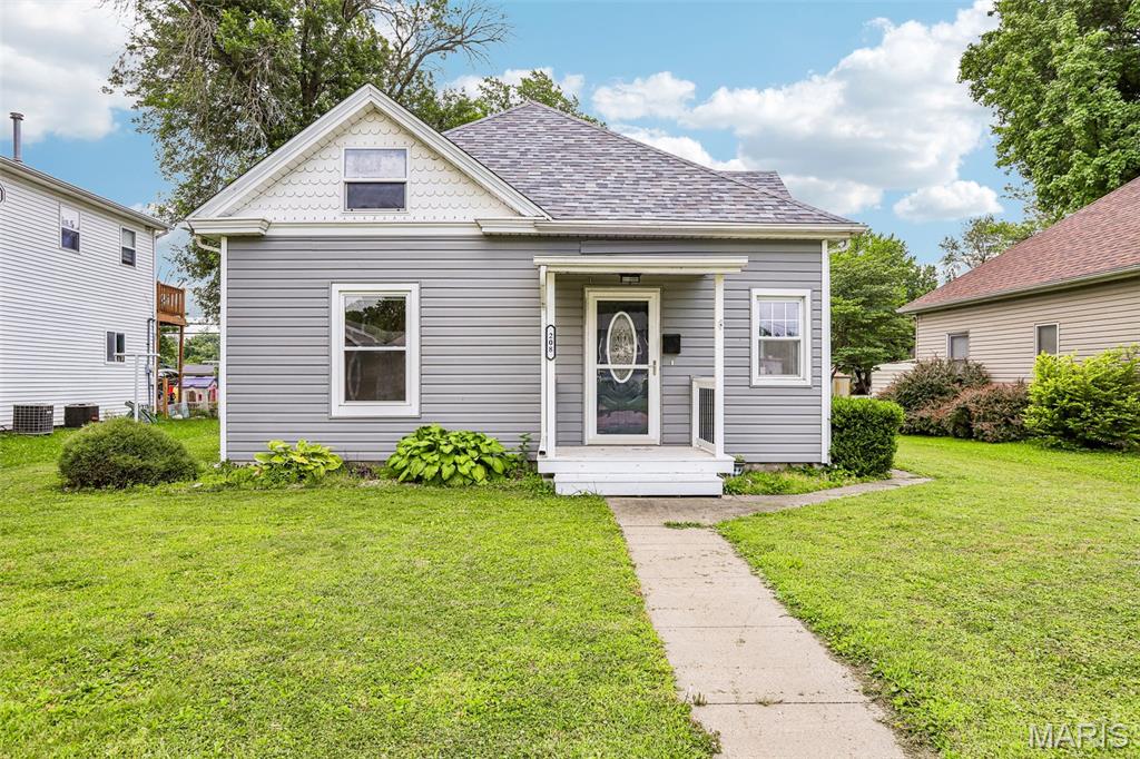 Welcome home to this solid and nicely maintained 1.5-story charmer offering 3 bedrooms and a full bath! Step inside to find a spacious living room with plenty of room for a small dining area, plus an inviting kitchen featuring attractive cabinetry and stainless steel appliances—the refrigerator, stove, dishwasher, washer & dryer all stay. You'll love the tastefully updated full bathroom! Two generously sized main-floor bedrooms each boast good-sized closets, while the private upstairs bedroom offers its own heating and cooling (window unit included) and a roomy closet for extra storage. Outside, enjoy a nice fenced yard with a classic picket fence, a small patio perfect for relaxing, and a 2-car detached garage with convenient alley access. This well-cared-for home is ready for its next owner