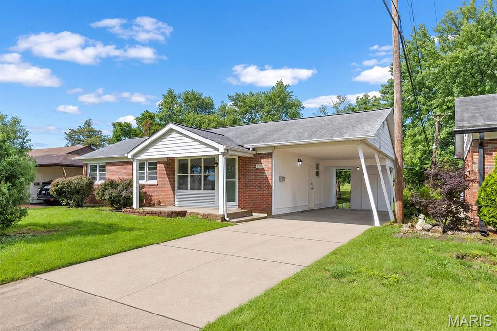 Welcome home! This gorgeous, fully updated brick ranch is the perfect blend of classic charm and modern style that you've been searching for. From the moment you walk in, you'll love the bright and airy open-concept living space with brand-new luxury vinyl plank flooring, recessed lighting, and fresh neutral paint that ties everything together beautifully. The living room is filled with natural light pouring through large picture windows, and the adjacent dining area is just right for hosting family dinners or casual get-togethers. And wait until you see the wonderful family room — wrapped in windows on three sides, it's the kind of space you'll want to curl up in every single day!
The fully renovated kitchen is sure to impress, featuring warm honey-toned shaker cabinetry, stunning granite countertops, a full stainless steel appliance package including a Samsung range, over-the-range microwave, dishwasher, and refrigerator, plus a modern undermount sink with lovely garden views.
The primary bedroom is a true retreat, offering dual closets and a ceiling fan, while the additional bedrooms are equally bright and comfortable with the same great finishes throughout. Both bathrooms have been beautifully renovated — the full bath features spa-inspired green tile, a soaking tub with frameless glass slider, a wood vanity, and brushed gold fixtures, while the half bath is equally stylish with a gorgeous tile surround, cane-front vanity, and charming sconce lighting.
Heading downstairs, the finished basement is a fantastic bonus with fresh LVP flooring, recessed lighting, plenty of storage closets, and a utility/laundry area — ready to become whatever you need it to be, whether that's a rec room, home gym, or cozy home theater!
Outside, the home's curb appeal is sure to impress with a covered carport, lush green lawn, and beautiful mature trees that provide wonderful natural privacy. The spacious backyard is a great size with plenty of room to garden, entertain, or simply enjoy the outdoors.
This one truly has it all — come see it for yourself!