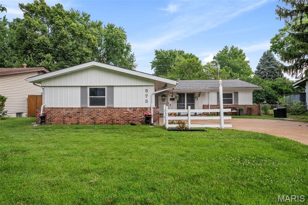 Discover this charming 4-bedroom, 2-bath ranch home in the heart of Hazelwood, MO, offering 1,568 square feet of comfortable, single-level living. Step inside to a wonderful open floor plan perfect for entertaining, anchored by a beautifully updated kitchen featuring stylish grey cabinets, stainless steel appliances, and a spacious island with abundant counter and storage space. The generous master suite boasts two large closets and an updated full bath, while three additional bedrooms provide ample closet space and share a second updated full hall bath. Outside, enjoy a level backyard ideal for gatherings with friends and family, plus an oversized attached garage with room for two vehicles and extra storage. With thoughtful updates throughout, this move-in-ready home is a fantastic find for anyone seeking space, style, and convenience in a well-established Hazelwood neighborhood.