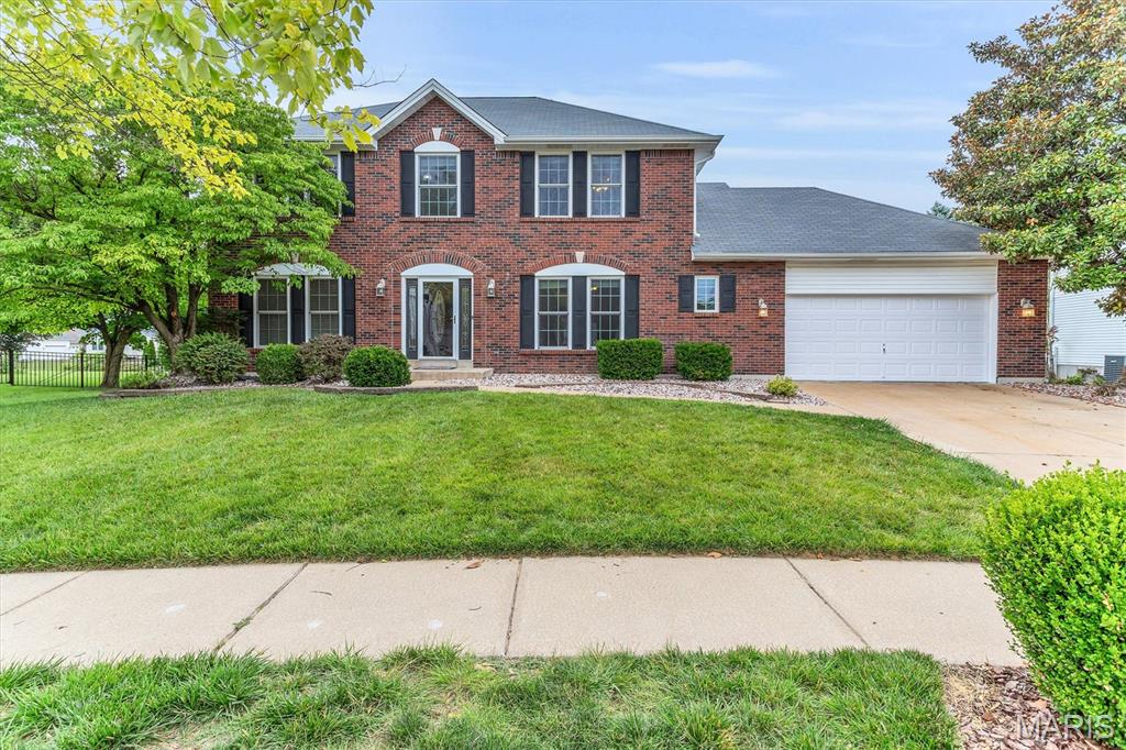 This is an incredible 2 story in the sought after neighborhood of Presidio.  The home features a full BRICK front, vinyl siding, enclosed soffits, architectural shingled roof, black shutters, Stone patio, Firepit, professional landscaping and irrigation all on a beautiful third of acre lot.   Interior has over 2600 sq ft, 4 bedrooms, 2 full baths and 1 half bath, 2 car garage.  Main level has front dining room and study/den.  Open floorplan between the greatroom, breakfast room, and kitchen.  Main floor laundry.  Features include Hardwood floors, crown molding, kitchen center island and breakfast bar, Kitchen desk, double pantry, laundry room cabinets and cubbies, Large greatroom with woodburning fireplace, brick surround and hearth, built in bookcases.  Enjoy the Four season room which is heated and cooled separately.  Primary bedroom suite with luxury bath, dual sinks, step up jacuzzi tub, walkin closet, 3 additional generous size bedrooms.  Lower Level is ready for you finish.  Two new 40 gallon water heaters, Dual/Zoned HVAC, and so much space for finish, storage, and a workshop.  

Itemized List:
Inground sprinkler system
-VacuFlow inline vacuum system-basement, main floor, 2nd floor and garage
-Jacuzzi Whirlpool w/jets, dual head shower & body jets in masterbath
-Hardwood floors and ceramic tile on main floor
-Built in bookshelves either side of fireplace
-300 sqft sunroom with new (2026) HVAC system
-New windows, shutters and front door trim on front of house-2024 St. Louis Design & Build
-Oversized garage
-4 Person custom locker organization system and utility sink in laundry room
-North Star Reverse Osmosis Drinking Water System-kitchen
-Dual zoned HVAC system
-Finished patio with fire pit, water feature and LED dust to dawn exterior lighting
-Large center island in kitchen, black granite sink, solid surface countertops (Hi-Mac)
-Ceiling fans in every room
-9ft ceilings-main floor

Please note the Washer  & Dryer are 3 years old and will stay with the home.
