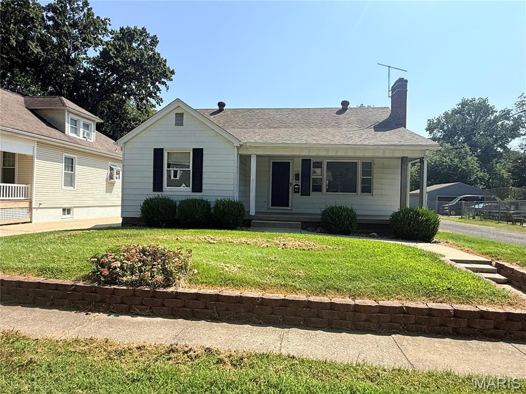 Versatile Collinsville Property with Multiple Living Spaces & Income Potential! This well-maintained 1940 home sits on a desirable corner lot and offers an unusual amount of flexibility. The main home retains the character of its era and includes a completely finished lower-level apartment with its own kitchen, laundry, and separate entrance—ideal for extended family, or guests. Beyond the carport, the detached garage has been converted into a second one-bedroom, one-bath living space with a kitchen, offering even more possibilities. The front home has previously rented for $1,800/month, while the rear living space has rented for $800/month. Whether you're looking for a multi-generational setup, additional living space, or an investment opportunity with multiple potential income streams, this unique property is worth a look!