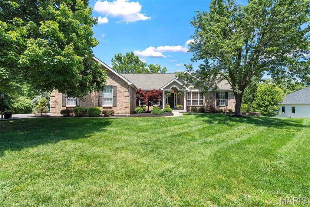 Don't miss this beautiful ranch home in the highly sought-after Radcliffe Place Subdivision. This exceptional home offers more than 4800 total square feet of living space with an open and inviting floor plan and sitting on a cul-de-sac on1.4 acres. Come on in and discover this home that was designed for comfortable living and entertaining! A spacious private office and elegant formal dining room welcome you at the entry. The stunning great room features soaring vaulted ceilings and a wall of windows that fill the home with natural light while showcasing beautiful views of Mother Nature. The kitchen offers a breakfast bar and convenient access to the upper-level deck—perfect for morning coffee or evening relaxation. The sought-after split-bedroom floor plan provides privacy, with the spacious primary suite tucked away from the secondary bedrooms.  Vaulted ceilings and an extra large walk-in closet. The finished lower level is ideal for entertaining, featuring a huge recreation room, wet bar, additional bedroom, full bath, and walk-out access to an incredible oversized lower-level deck. Enjoy peaceful outdoor living on both levels while taking in the serene surroundings. Tons of storage, freshly painted, new carpet in the LL.  Lastly, its located in the award winning Rockwood School District. This home offers the perfect blend of space, privacy, and breathtaking views! You won't want to miss this house that you will want to call home.