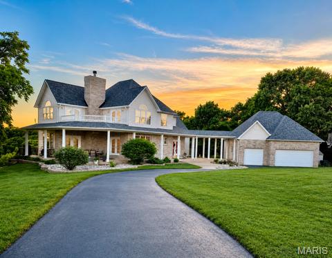 Seller says SELL IT THIS WEEKEND! Appraised at $800,000 in January 2026 BEFORE more than $100,000 in additional improvements were completed.

Nestled on 6.5 private wooded acres in sought-after Fischer Pointe Estates, this custom-built home offers the perfect blend of privacy, space, and outdoor living. The main level features an open floor plan with vaulted ceilings, a wood-burning stove, spacious living areas, and a primary suite designed for convenient main-floor living.

Upstairs, you'll find three additional bedrooms plus a second living area—ideal for a playroom, media room, or family gathering space. The fully finished walk-out lower level expands the home's versatility with a full kitchen, full bath, sleeping area, and abundant recreation space perfect for entertaining, guests, multi-generational living, or a private retreat.
Additional Information available -  https://listings.threedoors.com/5009-fischer-way

Outside, enjoy a fully fenced saltwater pool with a brand-new liner, a wraparound porch, shaded deck, and stunning views of the surrounding wooded hills. The property also features a private campground area, dedicated target practice area, chicken coop, and endless opportunities for outdoor recreation right in your own backyard.

With three garage bays, room to roam, and a setting that feels worlds away while remaining convenient to everyday amenities, this is a rare opportunity to own one of Jefferson County's most unique lifestyle properties.

Additional photos and property website:
https://listings.threedoors.com/5009-fischer-way
