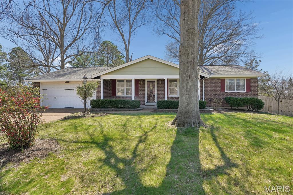 Situated on a picturesque bluff in desirable Oakville, MO, this light-filled 3-bedroom, 2-bath home at 2664 Sanders Dr offers comfort, space, and serene views surrounded by mature shade trees. The freshly painted interior features warm neutral tones and an open, welcoming layout with a spacious eat-in kitchen complete with pantry, room for a center island, and a window overlooking the backyard and playset. The kitchen flows seamlessly into the family room, where an oversized window floods the space with natural light and a cozy gas fireplace creates the perfect gathering spot. A front-facing living room with large picture window adds flexible space for entertaining or guest overflow. The primary bedroom includes a private full-bath ensuite, while two additional bedrooms and a second full bath complete the main level. Downstairs, the large unfinished basement is ready for your finishing touches—an ideal opportunity to add living space and build instant equity. Enjoy the park-like backyard with native gardens, patio, and playset (to stay), plus the convenience of a 2-car garage.  Enjoy peace of mind with new roof, gutters, downspouts, and some siding all less than a year old.  HVAC and water heater approximately 2 years old.  Don't miss this worry-free, delightful ranch home--all in a peaceful setting close to Oakville schools, parks, and amenities.